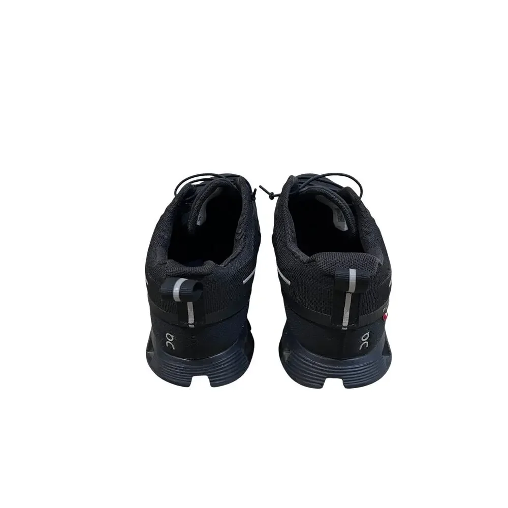 On Cloud waterproof running shoes for women in solid black.